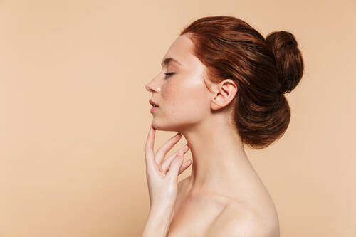 Image pretty young redhead woman posing isolated eyes closed