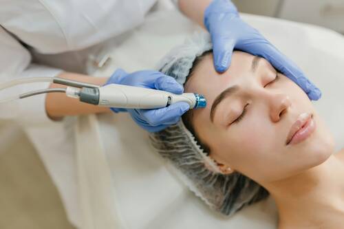 Closeup Portrait Of Beautiful Woman During Cosmetology Therapy In Beauty Salon. Procedures.